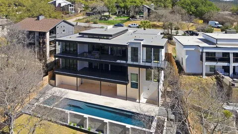 a terrace of a house with yard and outdoor seating