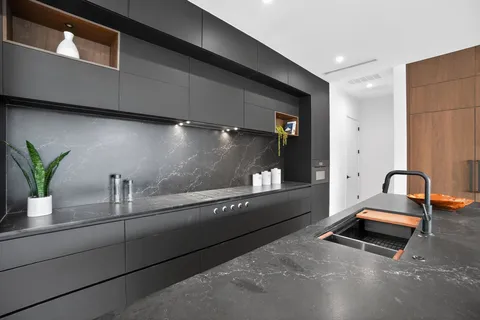 a kitchen with a sink and cabinets