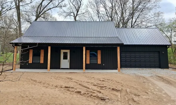 a front view of a house having yard