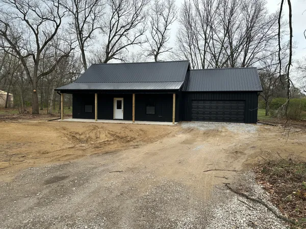 a house with trees in front of it