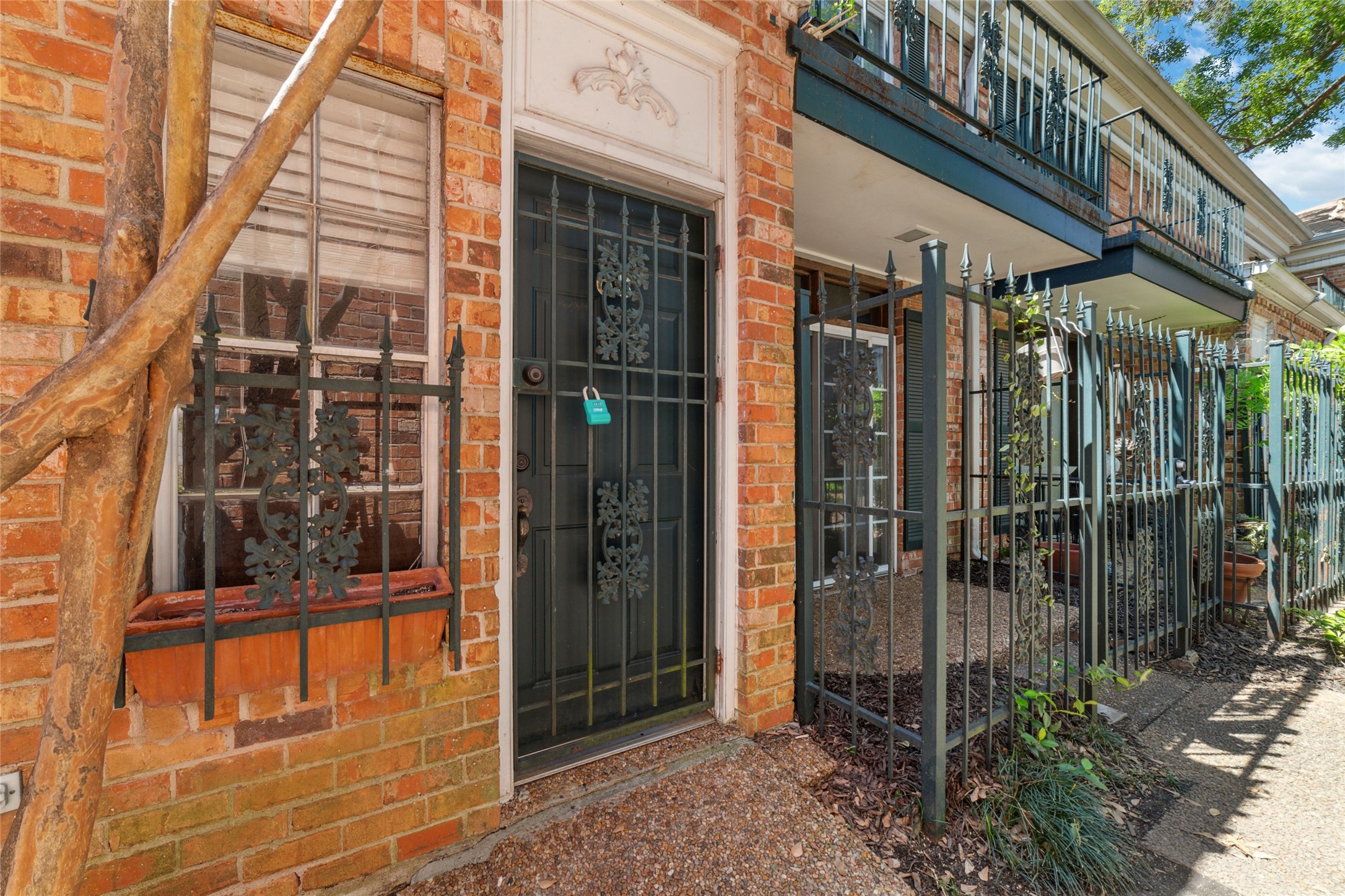3400 Timmons Lane, Unit 68 Houston, TX 77027 - Photo 1 of 20 a view of a brick building with a large window
