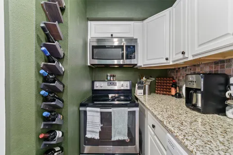 front view of a brick house with a yard