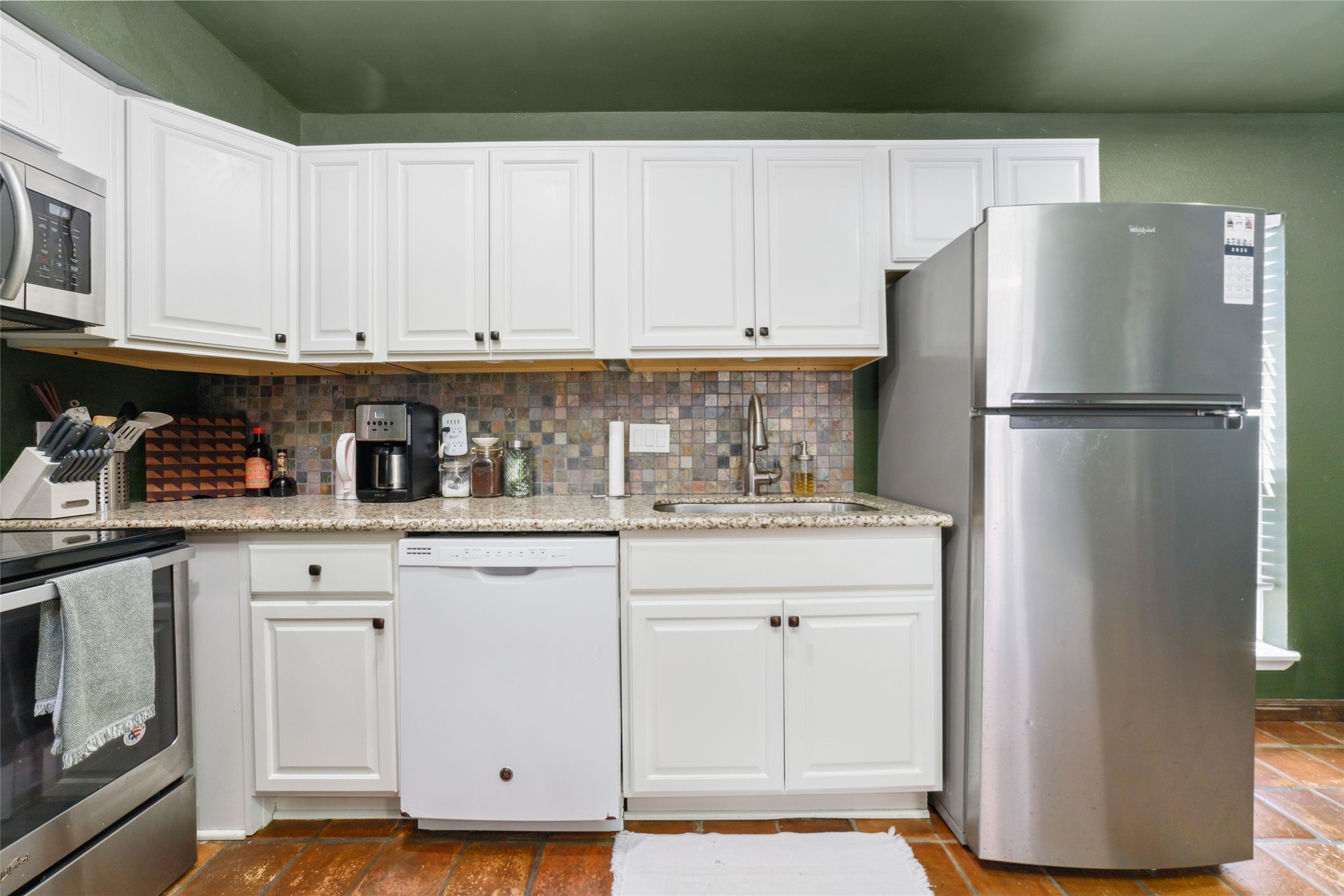 3400 Timmons Lane, Unit 68 Houston, TX 77027 - Photo 4 of 20 a white refrigerator freezer sitting inside of a kitchen