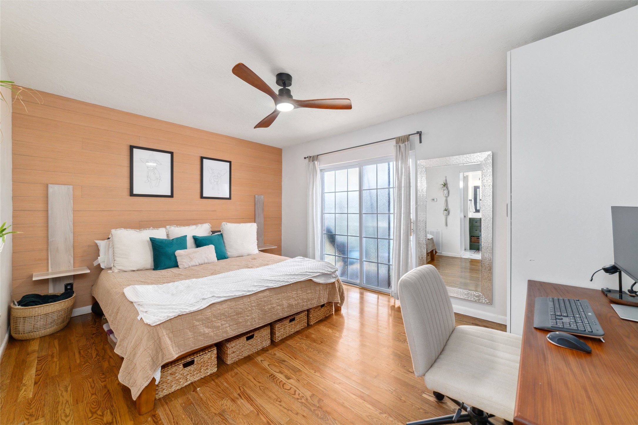 3400 Timmons Lane, Unit 68 Houston, TX 77027 - Photo 5 of 20 a bedroom with a bed and wooden floor