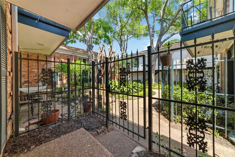 a bedroom with a bed and a view of kitchen