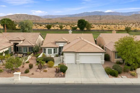 an aerial view of a house with a lake view