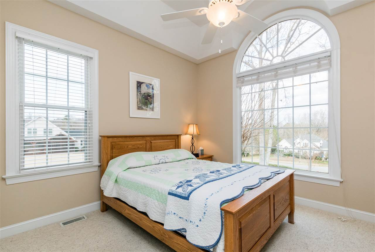 107 Austin Pond Road Clayton, NC 27520 - Photo 15 of 24 Split bedroom plan is a great feature of this home! Front guest bedroom with half moon window