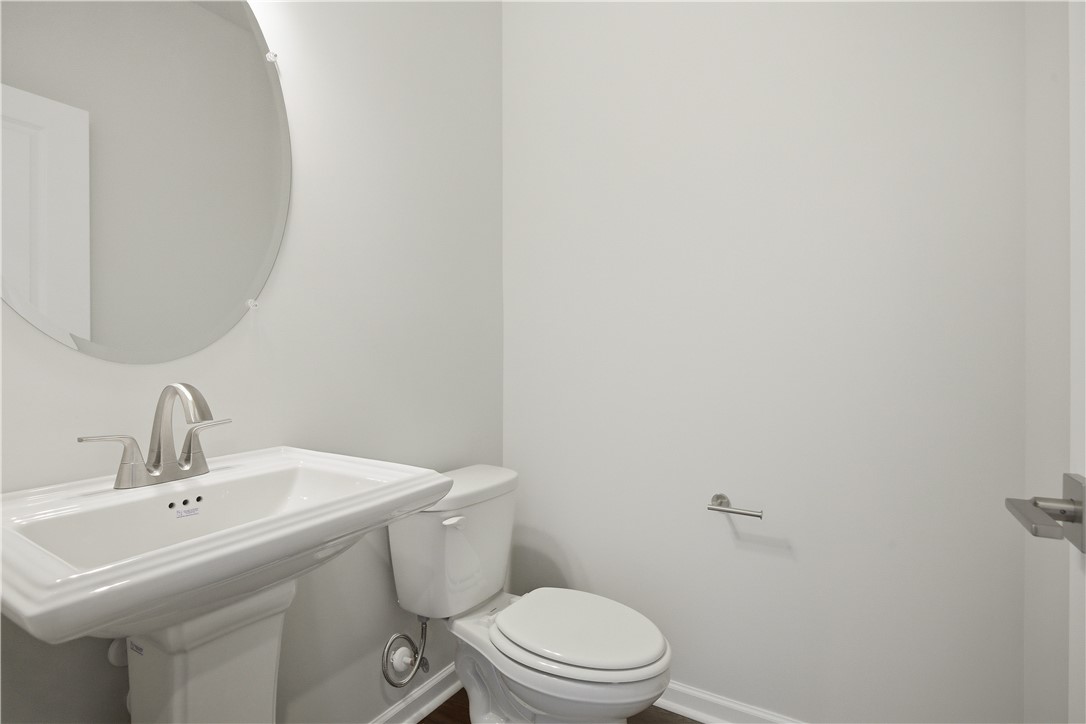 552 Hydrangea Street, Unit LOT 66 Seneca, SC 29678 - Photo 6 of 31 A well-appointed half bath features a pedestal sink and contemporary fixtures, offering convenience.