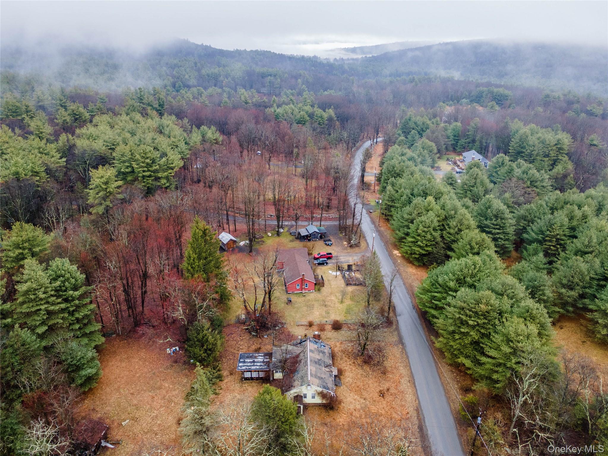 106 Sheldon Hill Road Olivebridge, NY 12461 - Photo 7 of 12 an aerial view of a house with a yard and mountain view in back