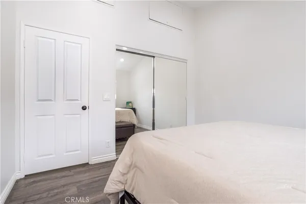 a bedroom with a bed and a table