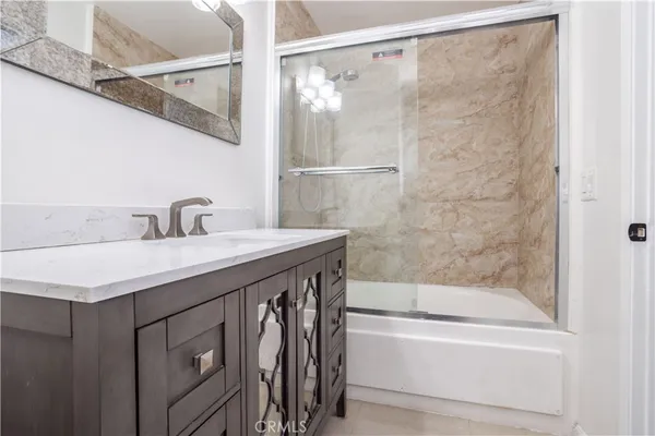 a bathroom with a bathtub and a sink