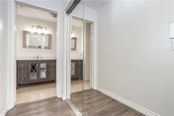 a view of a hallway with bathroom