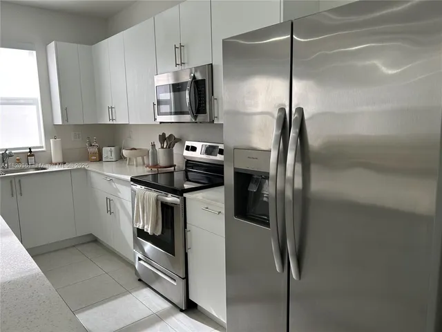a white toilet sitting next to a shower curtain