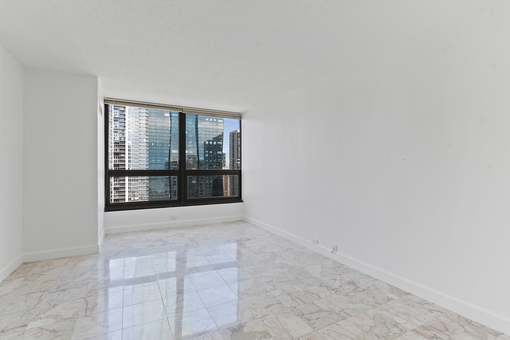 360 East Randolph Street, Unit 3105 Chicago, IL 60601 - Photo 15 of 28 an empty room with windows