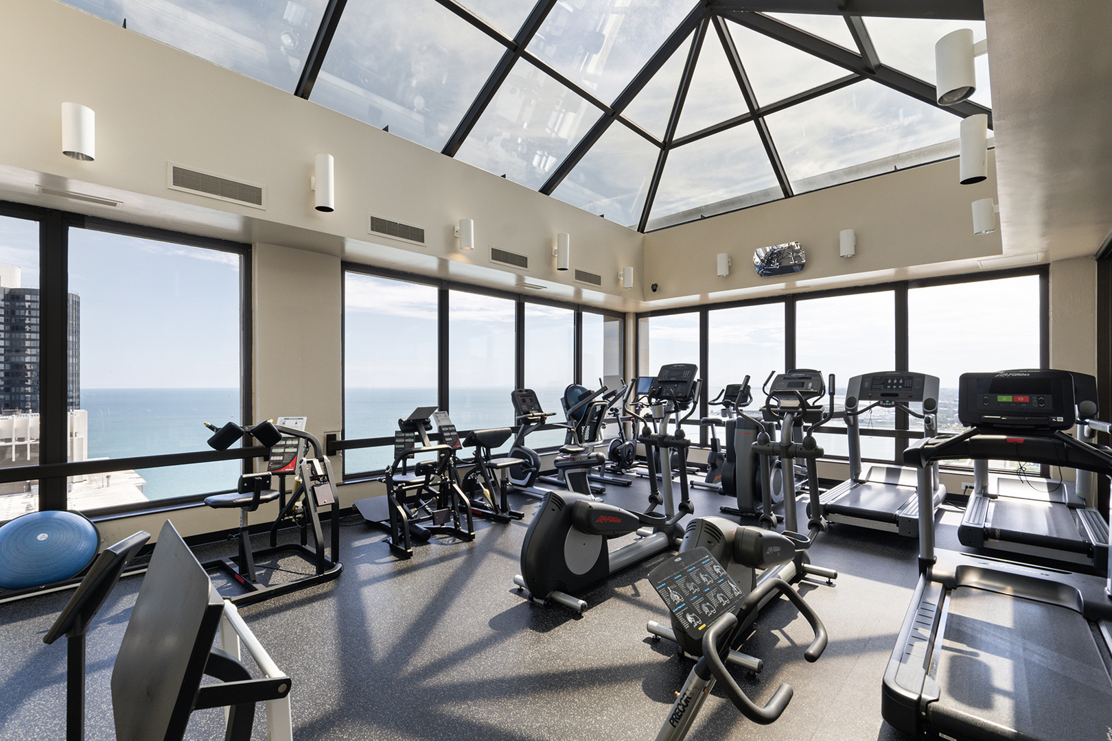 360 East Randolph Street, Unit 3105 Chicago, IL 60601 - Photo 24 of 28 a view of a room with gym equipment