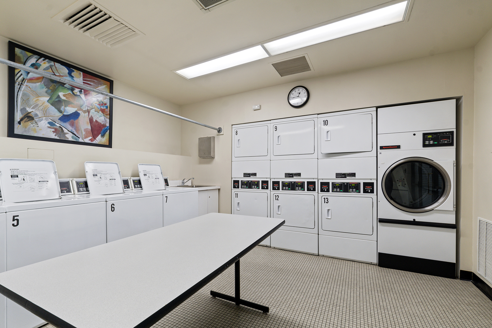 360 East Randolph Street, Unit 3105 Chicago, IL 60601 - Photo 25 of 28 a utility room with cabinets dryer and washer