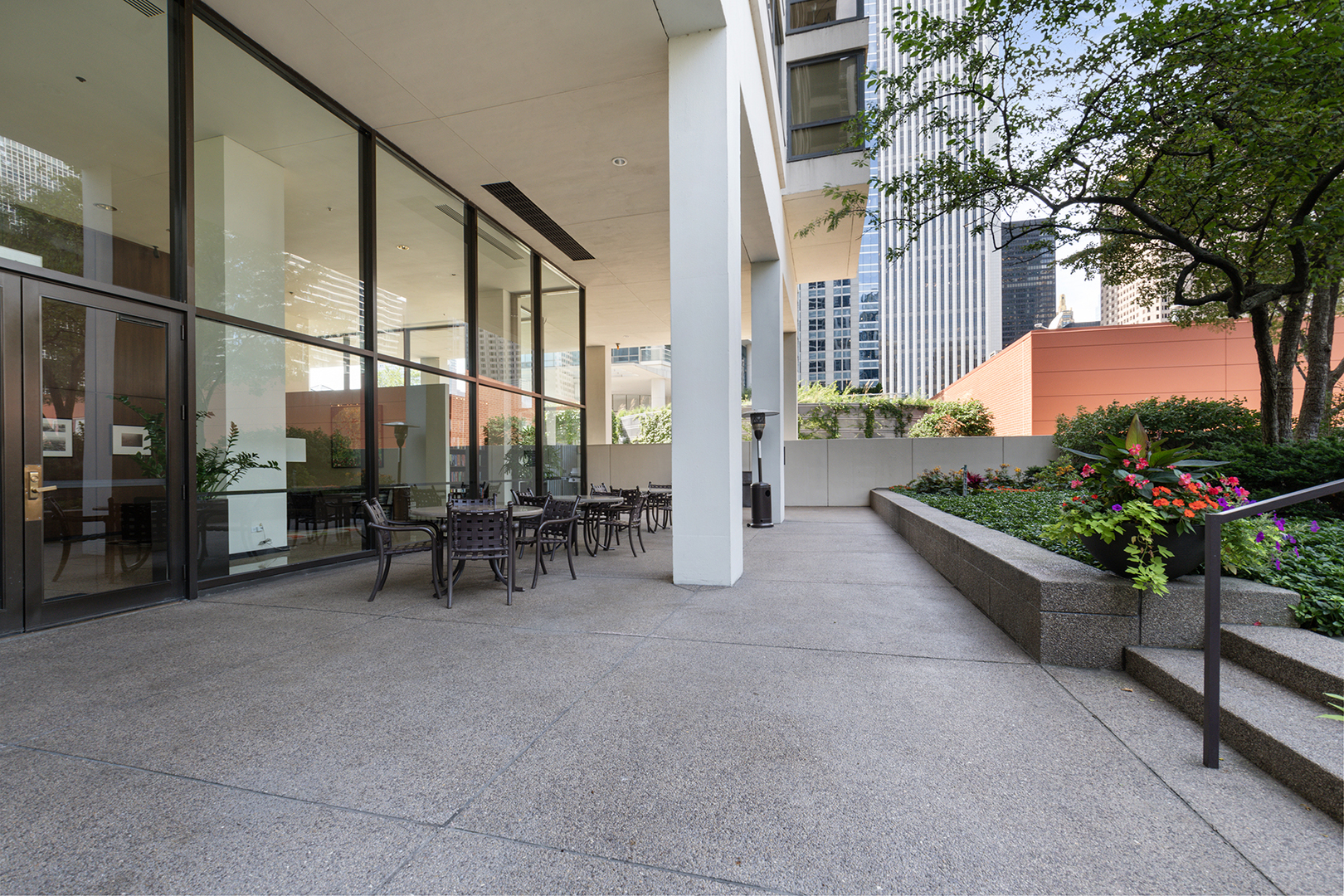 360 East Randolph Street, Unit 3105 Chicago, IL 60601 - Photo 28 of 28 a view of a chairs and tables in the patio