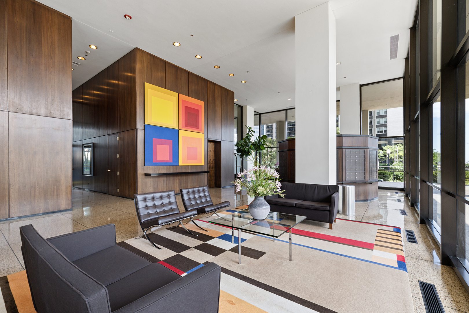 360 East Randolph Street, Unit 3105 Chicago, IL 60601 - Photo 3 of 28 a living room with furniture and a flat screen tv