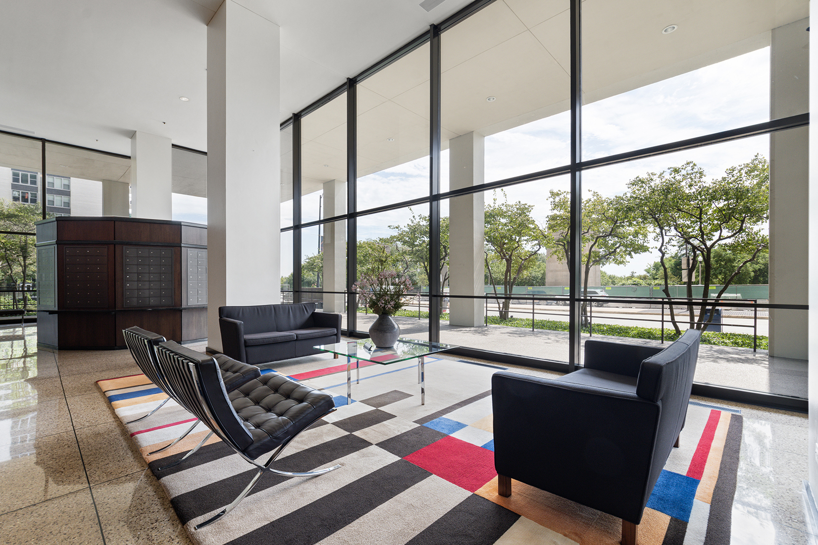 360 East Randolph Street, Unit 3105 Chicago, IL 60601 - Photo 4 of 28 a living room with furniture and a floor to ceiling window