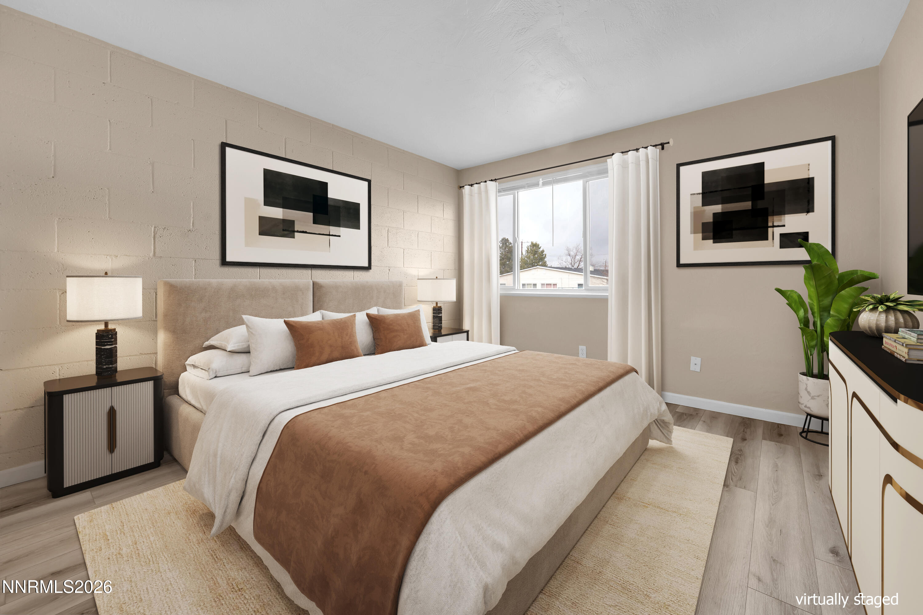 5381 Teton Street Reno, NV 89506 - Photo 19 of 28 a bedroom with a bed and a flat screen tv