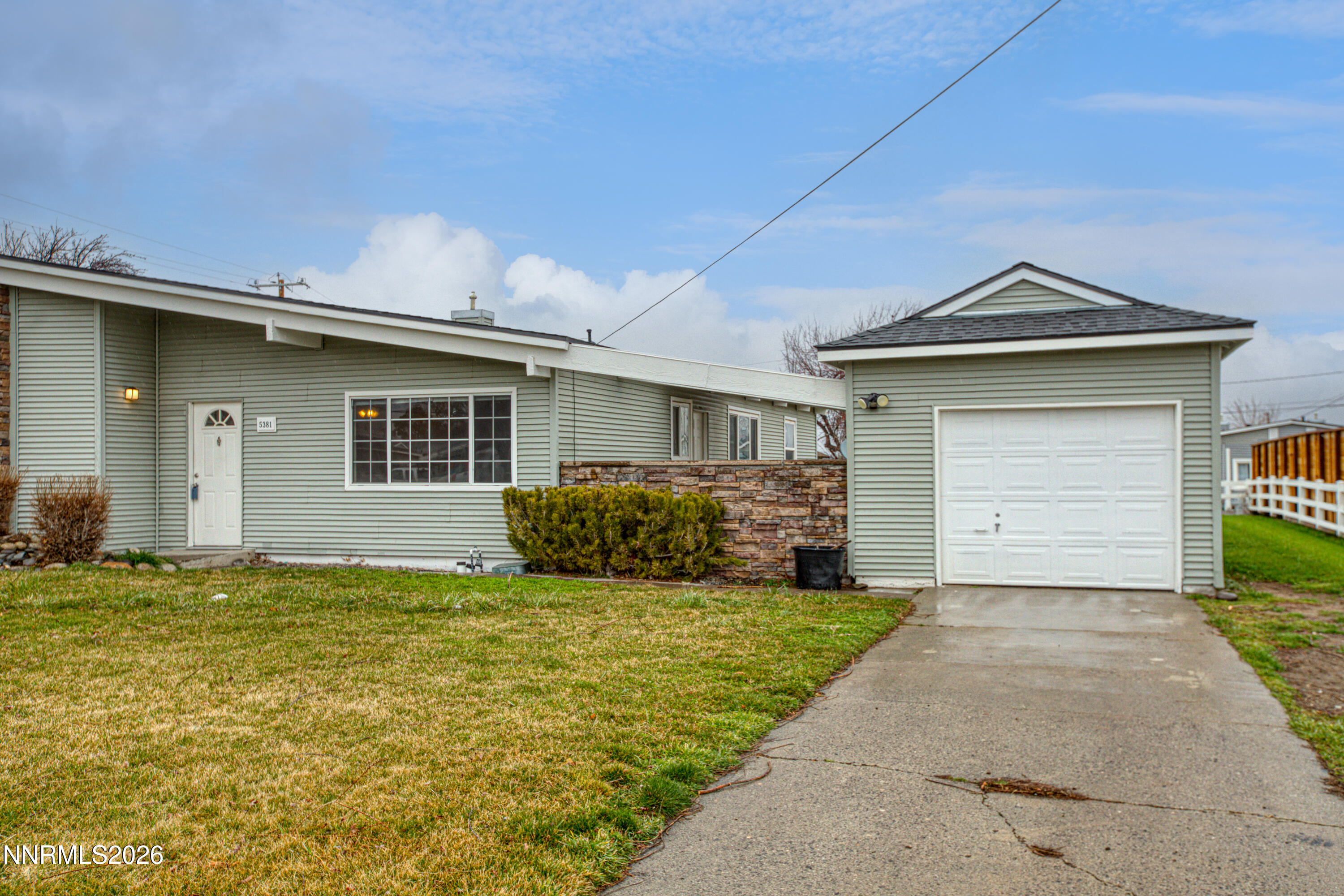 5381 Teton Street Reno, NV 89506 - Photo 28 of 28 a front view of a house with a yard