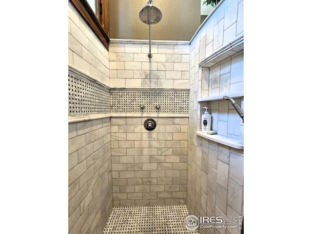 a bathroom with a toilet a sink a mirror and vanity