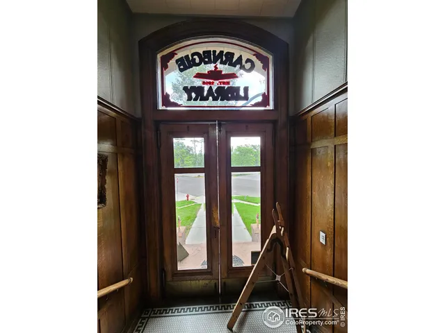 a view of living room with a flat tv screen and a potted plant