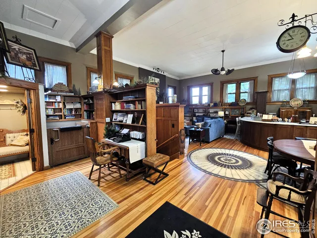 a outdoor living space with furniture and a book shelf