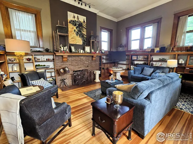 a living room with furniture and a fireplace