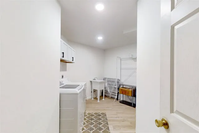 a room with furniture and view of bathroom