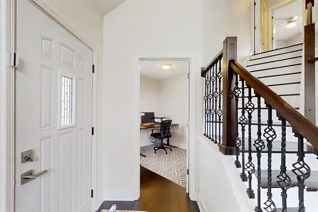 a view of a hallway with seating area