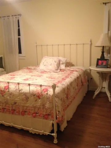 a spacious bedroom with a bed