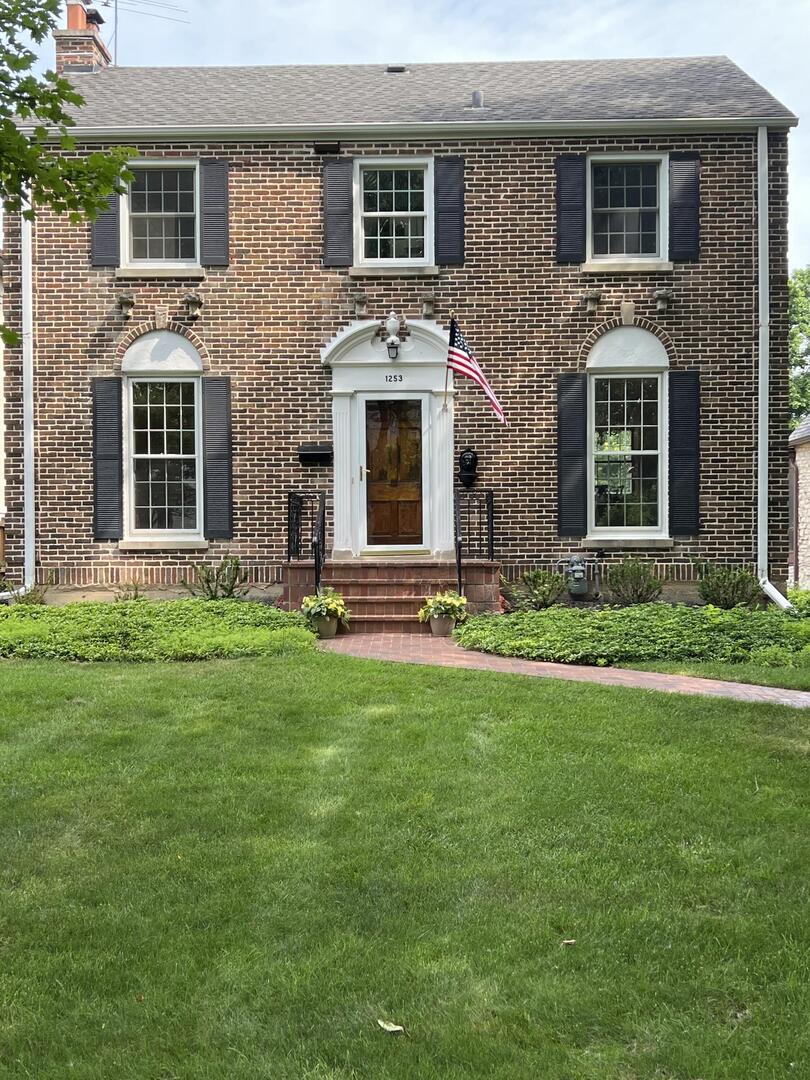 a front view of house with yard