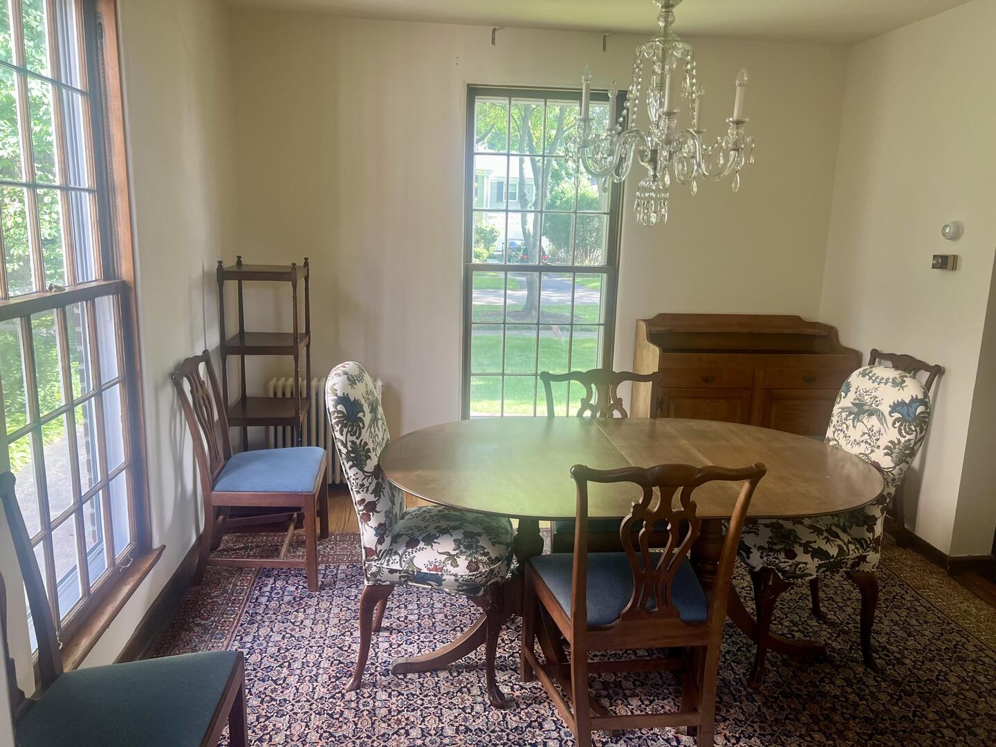 1253 Cherry Street Winnetka, IL 60093 - Photo 8 of 11 a dining room with furniture a chandelier and wooden floor