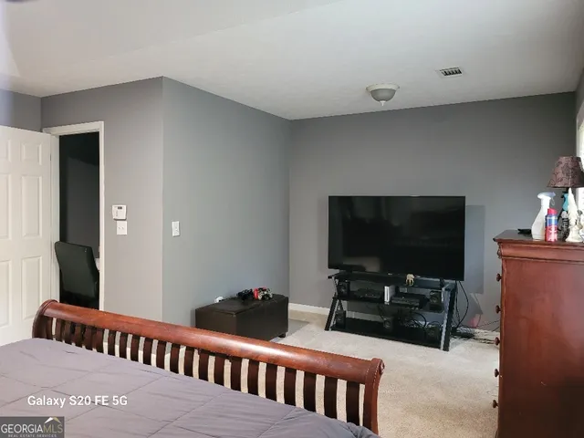 a bathroom with a sink vanity and mirror