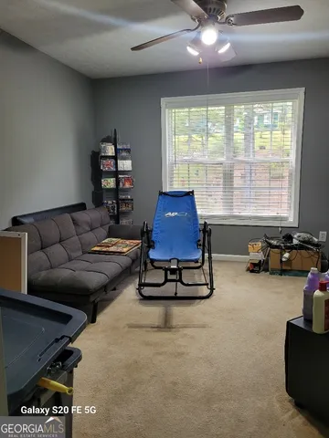 a bedroom with a bed and a television