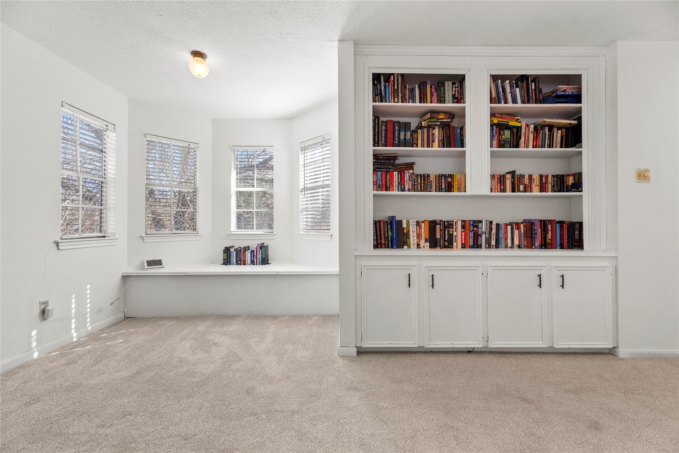 14926 Camino Rancho Drive Houston, TX 77083 - Photo 15 of 22 This view highlights the game room nook, offering a comfortable spot for lounging, studying, or setting up a small media area.