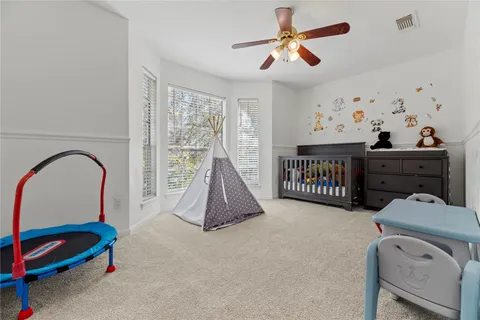 a bed room with furniture and a window