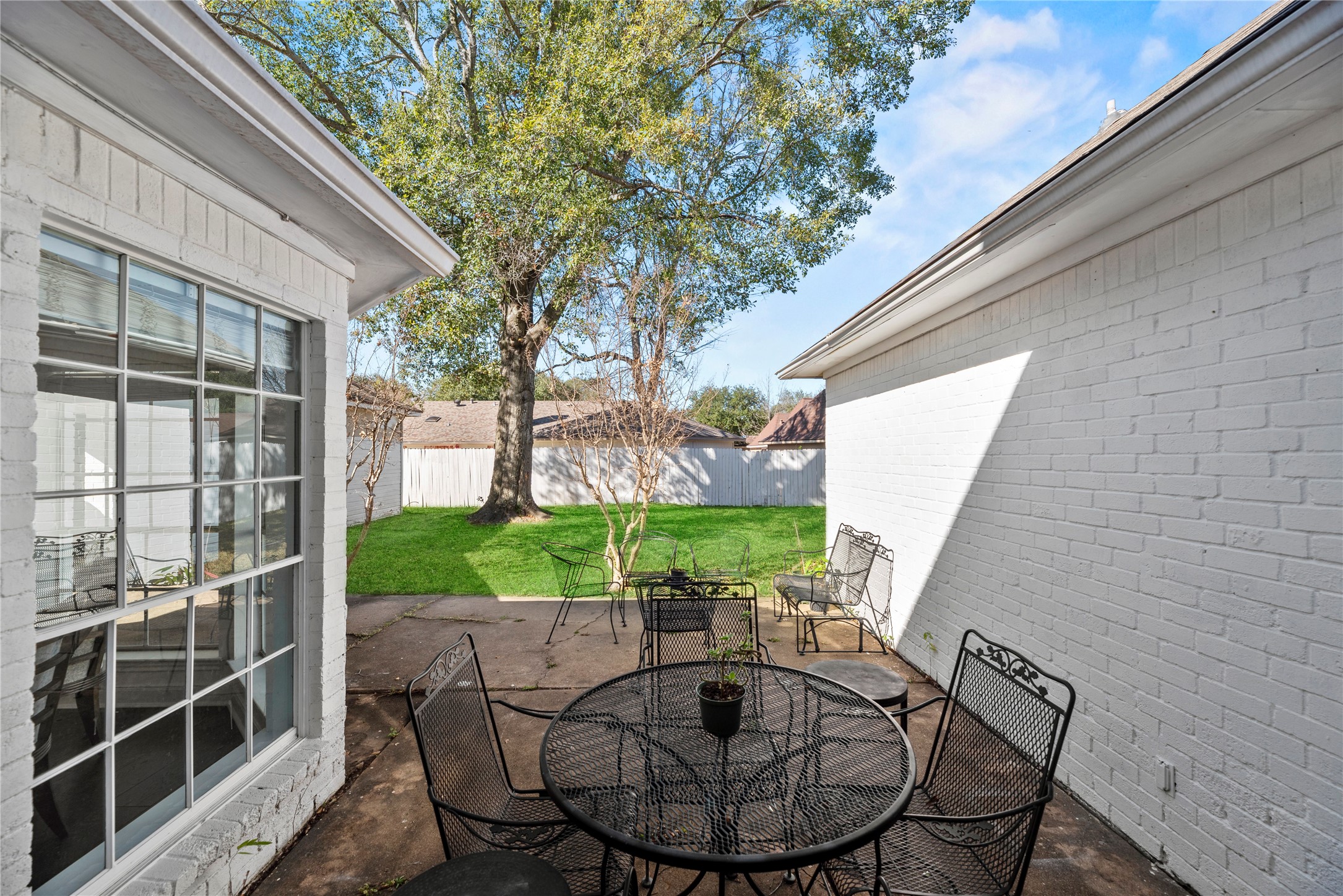 14926 Camino Rancho Drive Houston, TX 77083 - Photo 20 of 22 Enjoy the porch and deck, offering a comfortable outdoor spot to relax, unwind, or host casual gatherings.