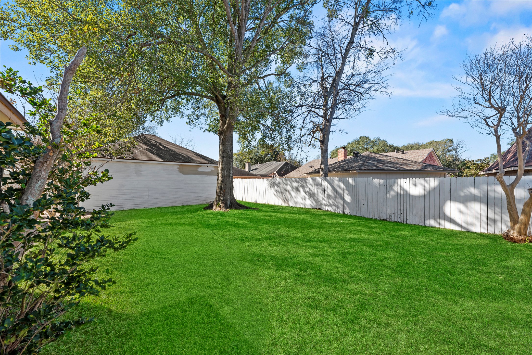14926 Camino Rancho Drive Houston, TX 77083 - Photo 21 of 22 Imagine making this spacious, fully fenced backyard your own, with plenty of room for weekend barbecues and everyday outdoor use.