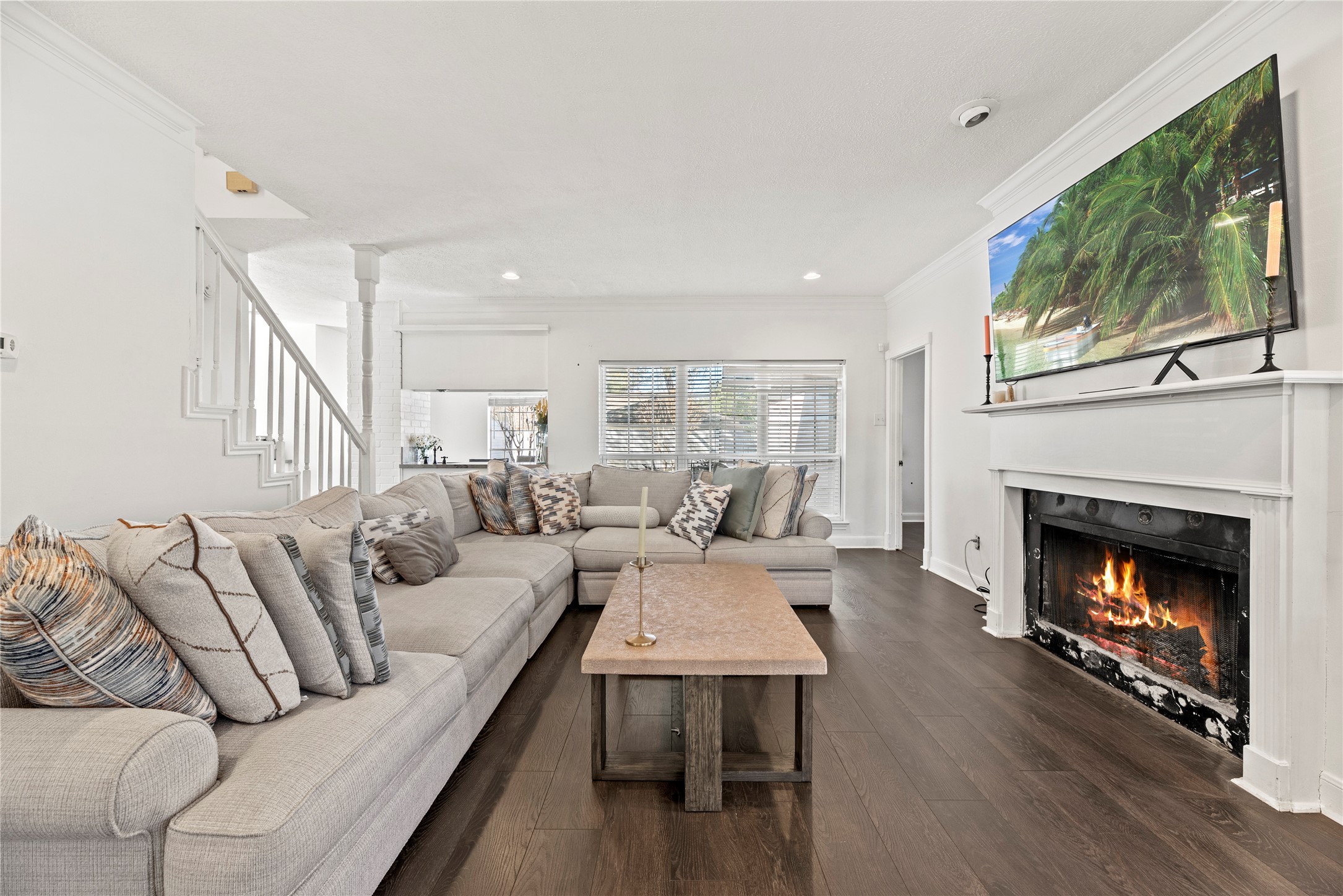 14926 Camino Rancho Drive Houston, TX 77083 - Photo 4 of 22 Discover the heart of the home in this living area, where the striking fireplace and open layout create the ultimate space for gathering. BONUS - Seller will install updated tile around the fireplace.
