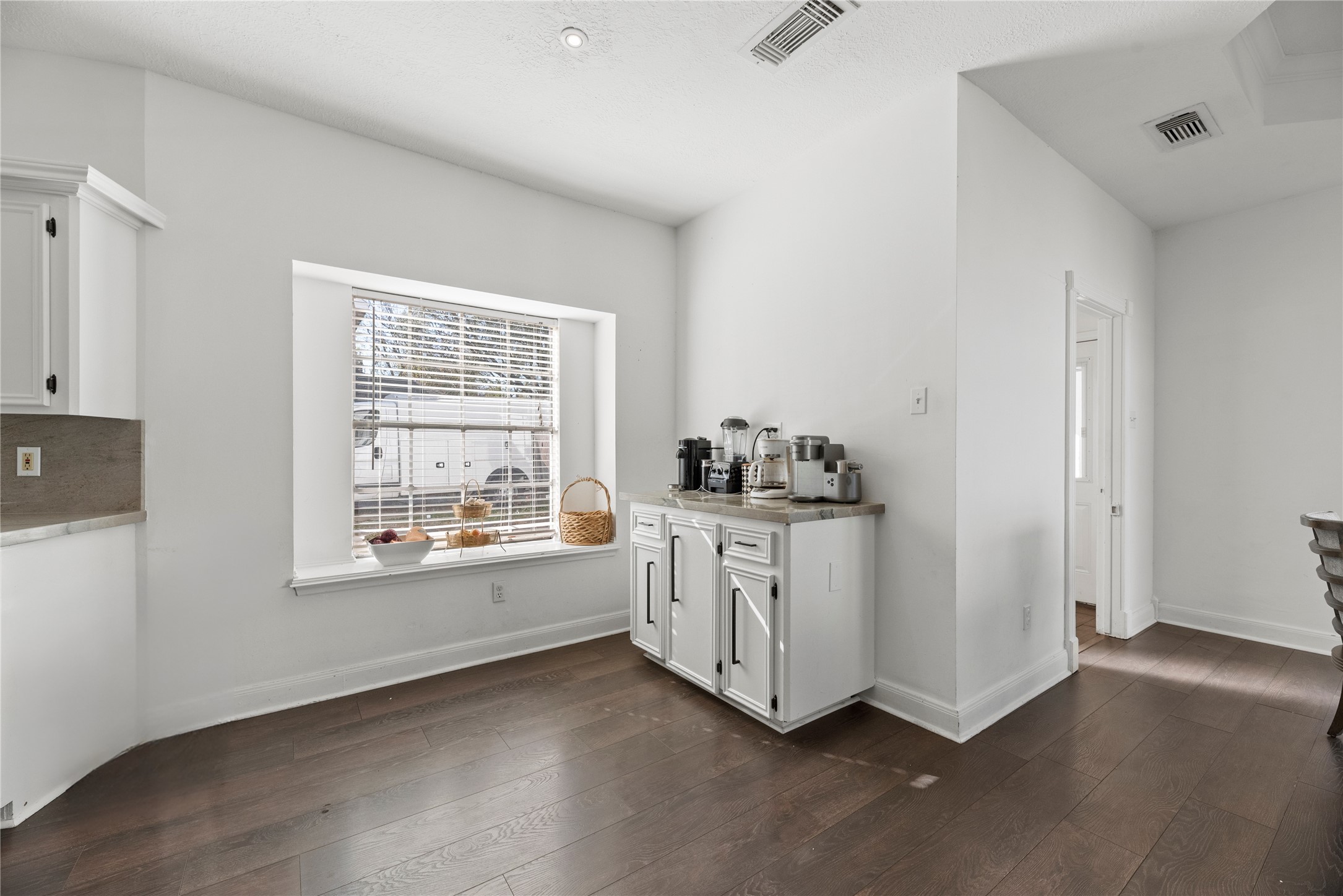 14926 Camino Rancho Drive Houston, TX 77083 - Photo 7 of 22 The coffee bar offers a convenient spot for mixing drinks or setting out snacks, making it an easy addition for gatherings.