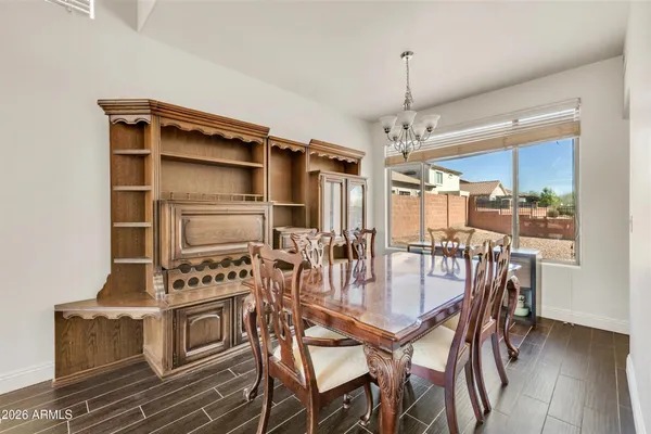 a bedroom with furniture and a wooden floor