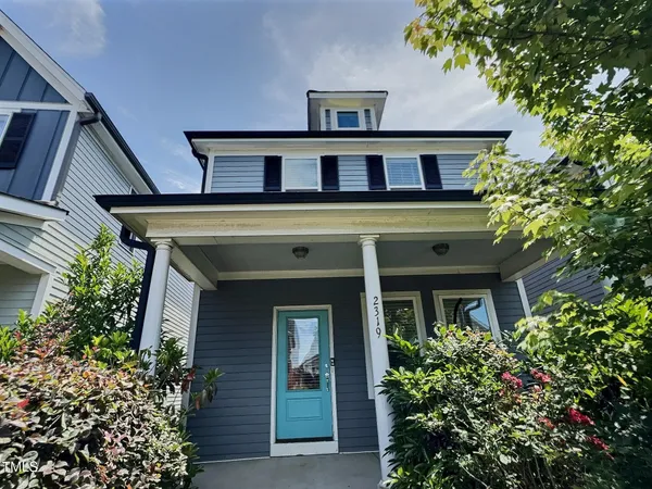 front view of a house with a small yard
