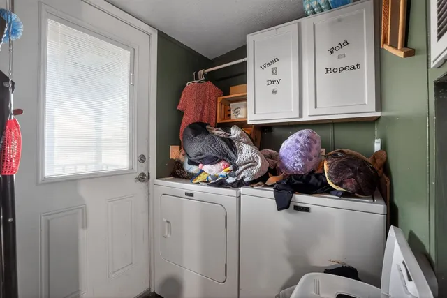 a bathroom with a sink a toilet and a window