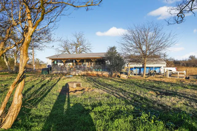 a view of yard with swimming pool and outdoor seating