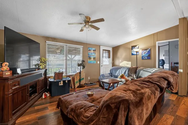 a bed room with two bed and a flat screen tv