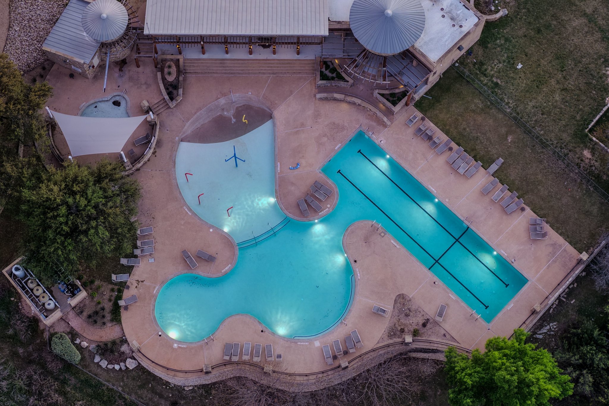 22204 Red Yucca Road Spicewood, TX 78669 - Photo 31 of 34 an aerial view of a house with a swimming pool and outdoor space