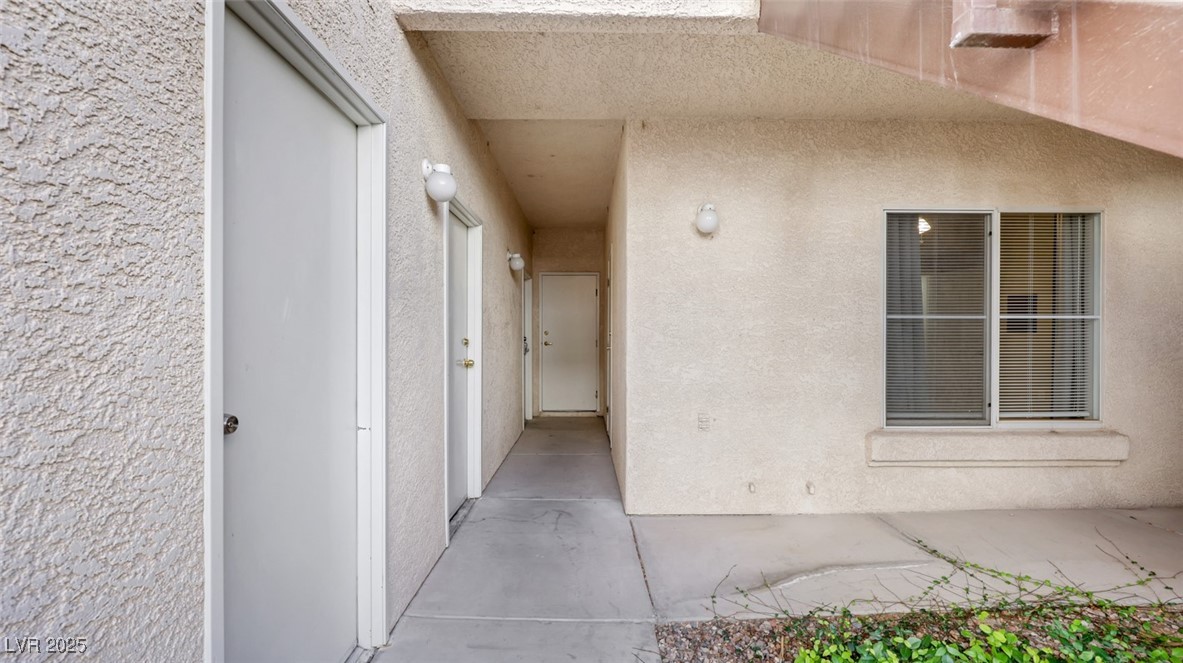 4921 Black Bear Road, Unit 104 Las Vegas, NV 89149 - Photo 35 of 35 Looking toward Garage (door on Left) and Second Bedroom (window shown), storage closet shares wall with bedroom 2 and front door is to the right of window