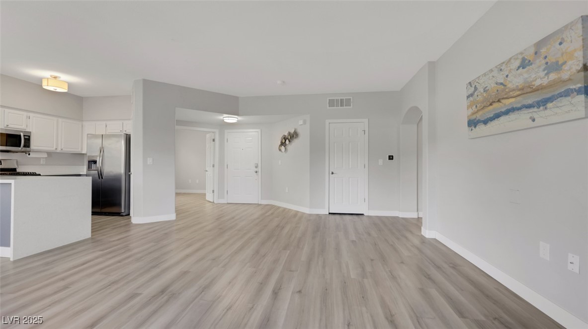 4921 Black Bear Road, Unit 104 Las Vegas, NV 89149 - Photo 9 of 35 great room looking to kitchen, front door and den